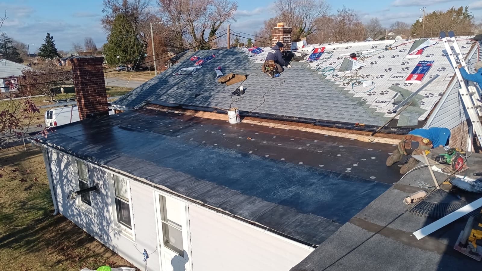 Low-slope TPO and shingle roof installation on a New Jersey home — aerial view of the dry-in stage by Zubar Roofing.