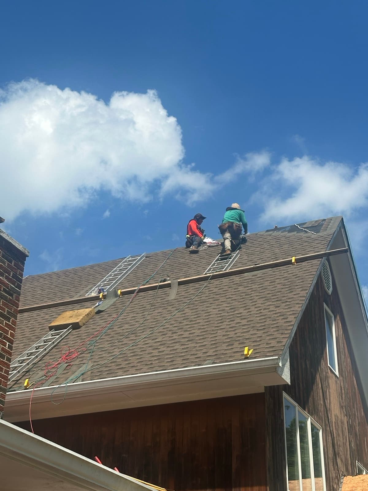 Zubar Roofing crew installing GAF architectural asphalt shingles on a new construction roof in New Jersey.
